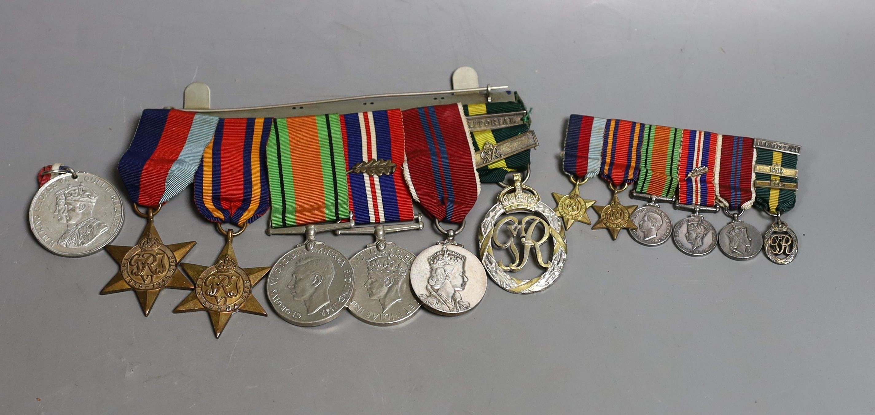A WWII medal group of six, with miniatures, and a royal commemorative medal, 1937